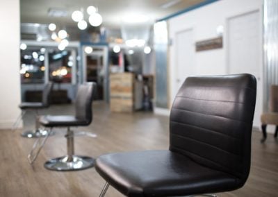 A living room with a leather chair - HM Spa and Salon - Permanent Makeup Tacoma